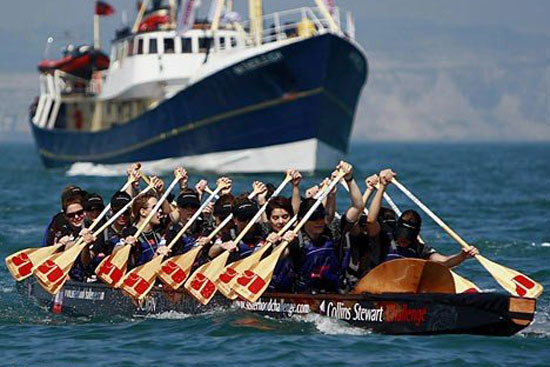 Natalie dragon boating with the Sisterhood